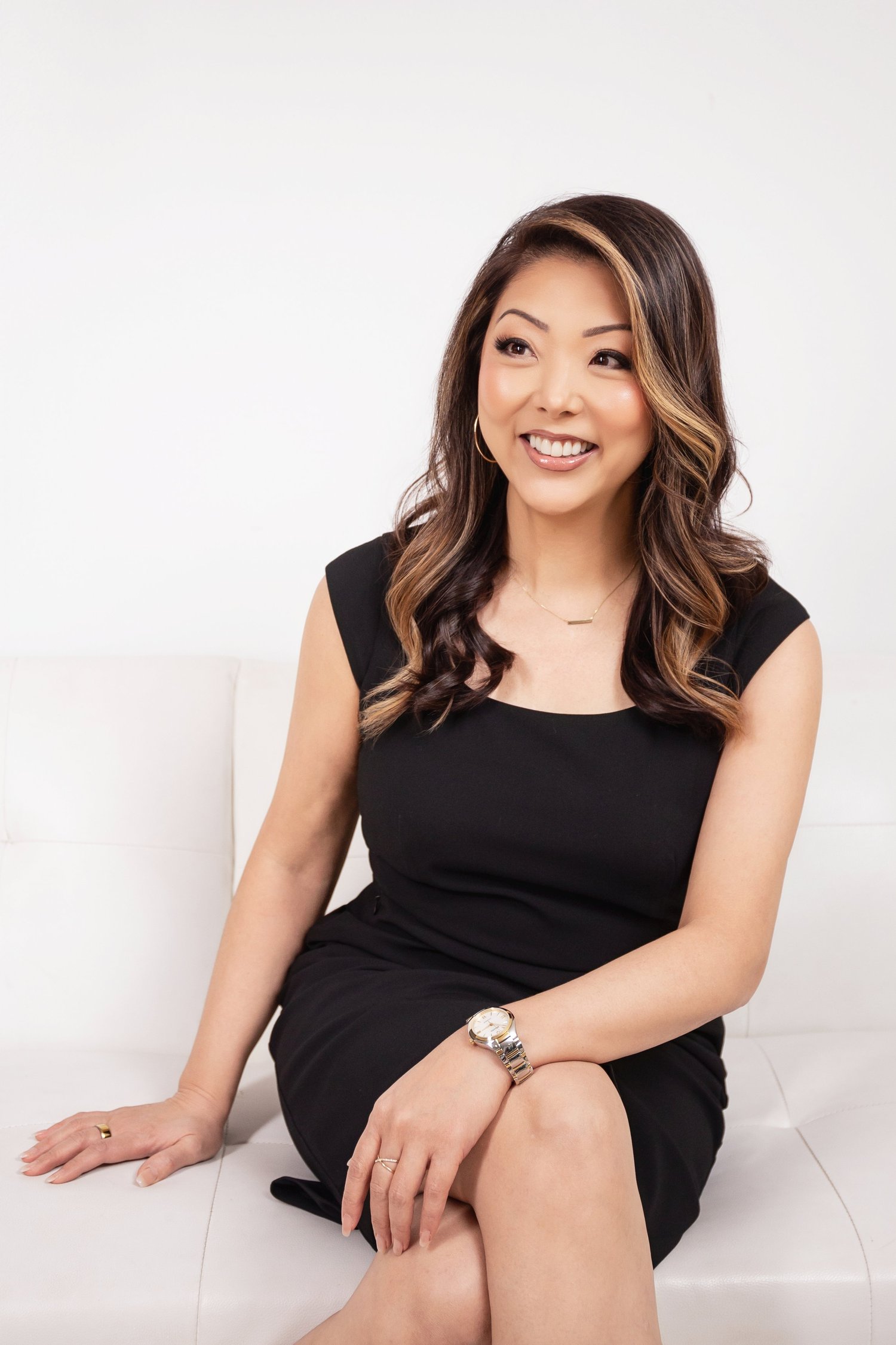 Chenise Kanemoto smiling while seated in her studio